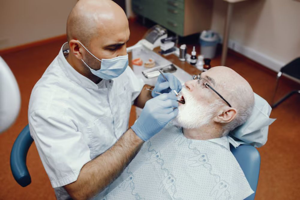 an old person getting dental treatment