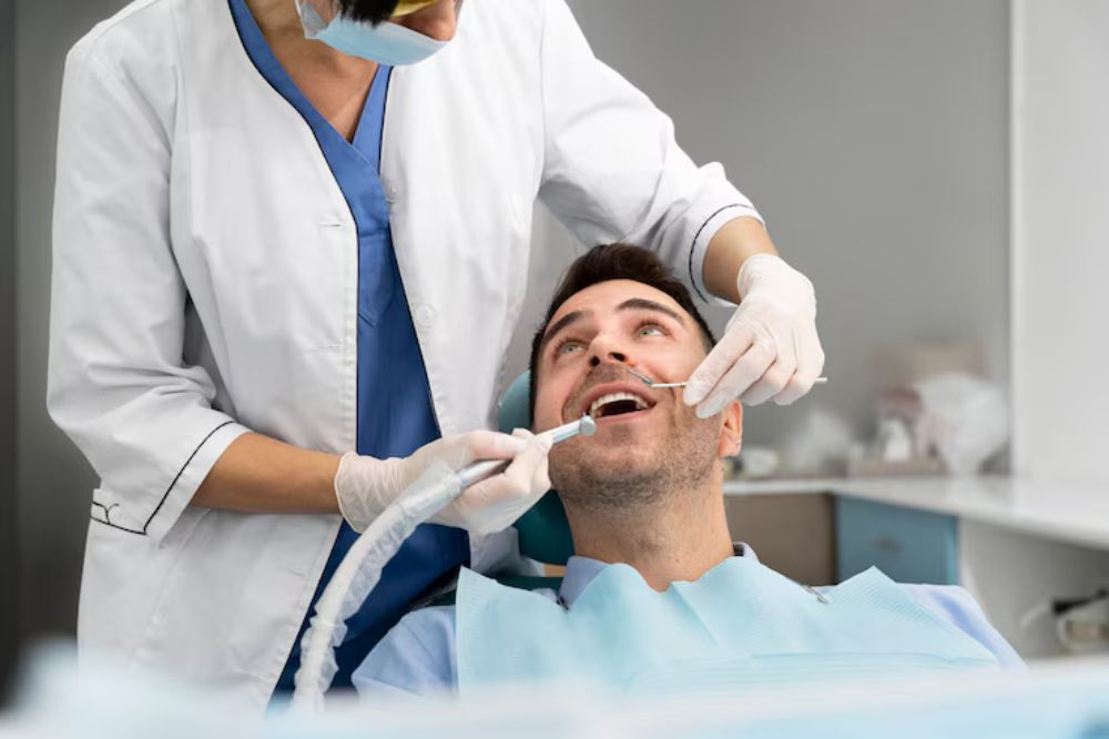 patient having dental restoration treatment from dentist