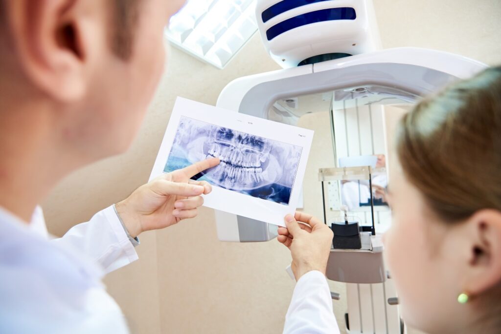 dentist showing dental report to a patient